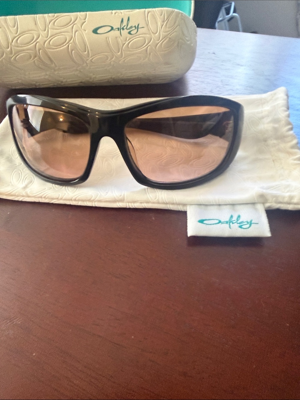 Oakley Gloss Black Sport Sunglasses with Rose Lenses. minor scratches on lenses